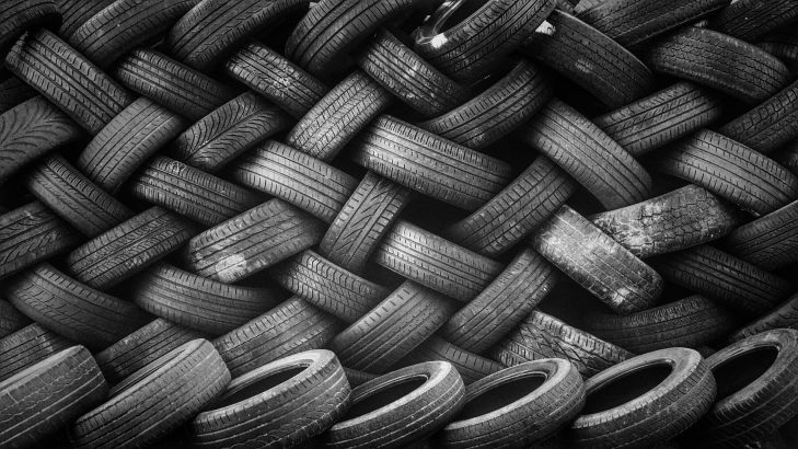 Pile of Rubber Automotive Tyres in An Industry