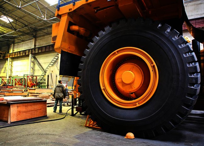 Image Represents The Modern Trachtor Parking in a workshop